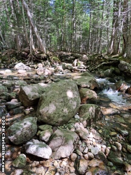 photograph of boulders and rocks in a stream