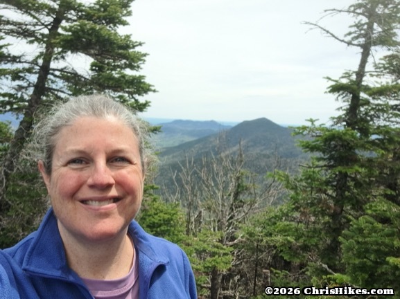 Photo of woman with mountains in the distance