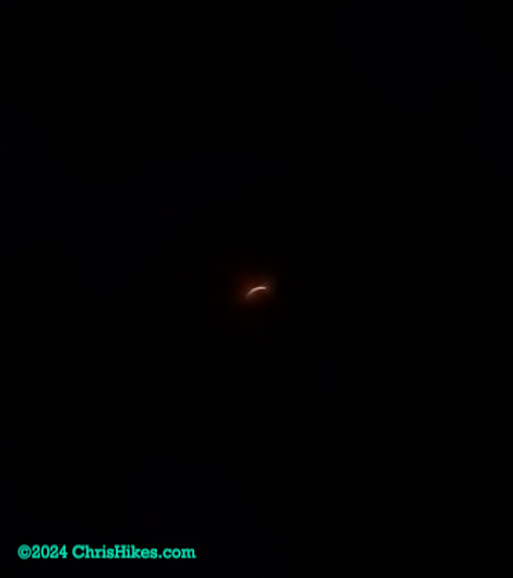 Partial eclipse with small sliver of sun before totality