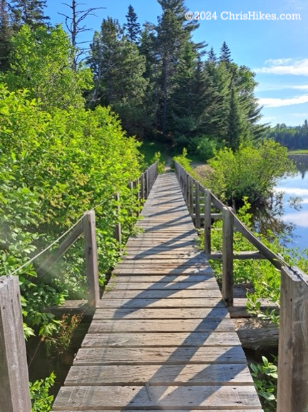 Bridge over outlet of pond