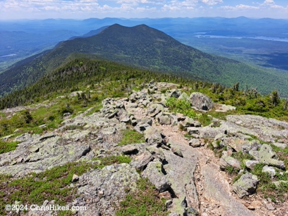 View across summit to nearby mountains: The Horns