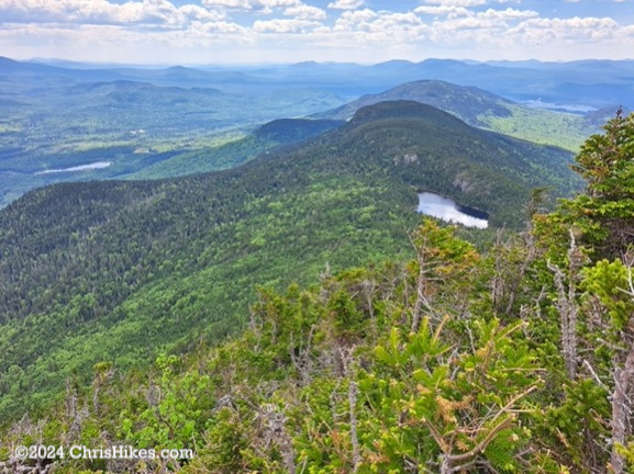 View of pond and mountains in the distance: Horns Pond and western Bigelow Range from South Horn