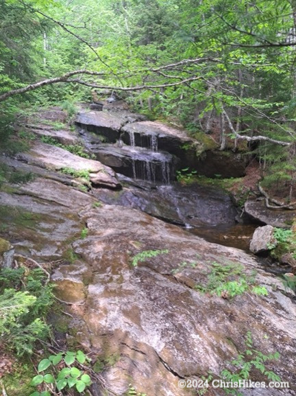 Photograph of waterfall with narrow trickles of water