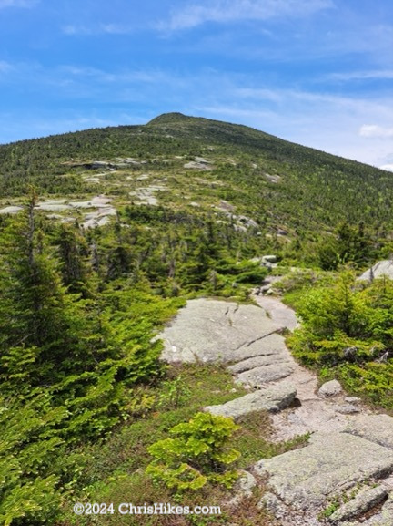 Photograph of trail going up Saddleback mountain.