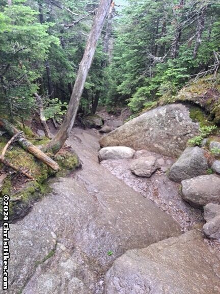 photograph of hiking trail down large boulders