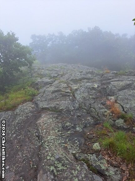 photograph of hiking trail over large rocks